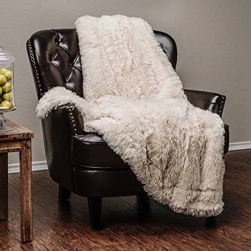 White fluffy throw over Leather armchair