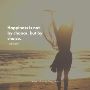 Image: Sillouhette of a girl with arms stretched up in front of a seashore. Quote “Happiness is not by chance, but by choice.” – Jim Rohn