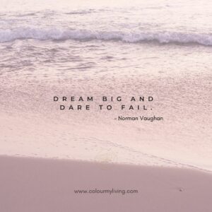 Image: Pink-tinted shoreline. Quote: Dream big and dare to fail.” – Norman Vaughan