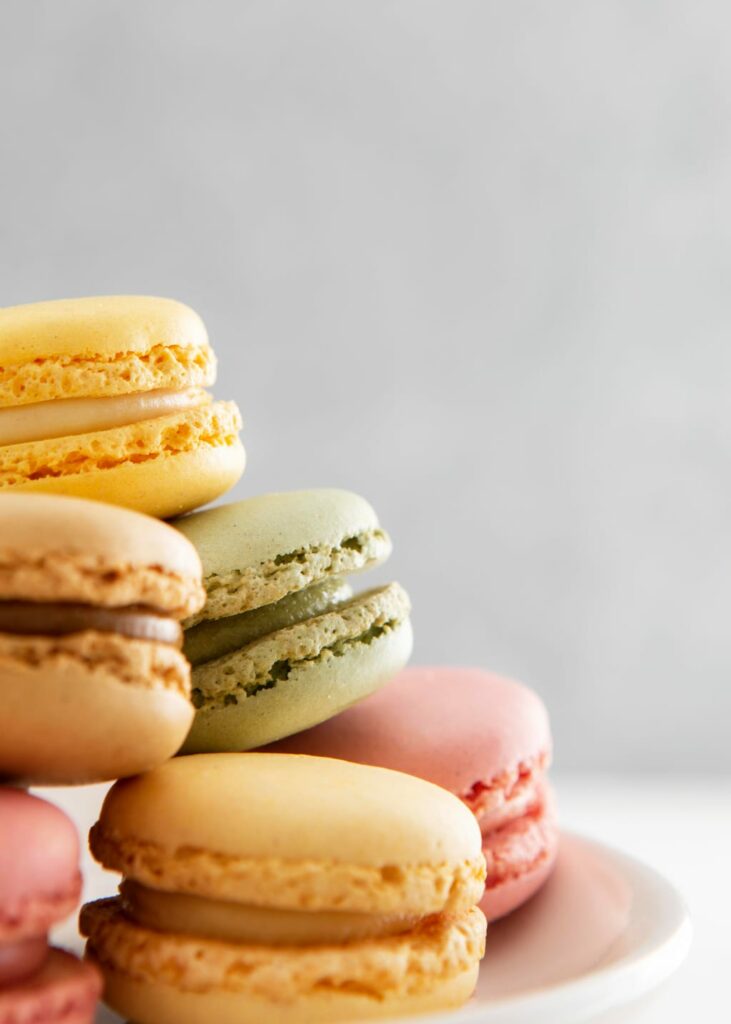 a colourful pile of macarons arranged in a pyramid form